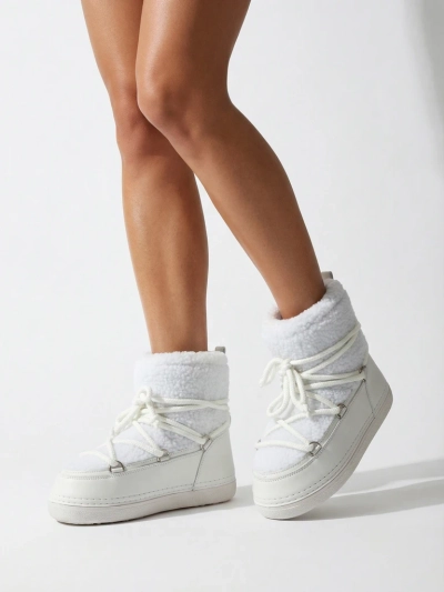 Ženski škornji za sneg s kožuhom Uvella