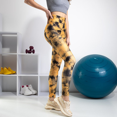 Žlté dámske legíny s ozdobnými škvrnami - Oblečenie