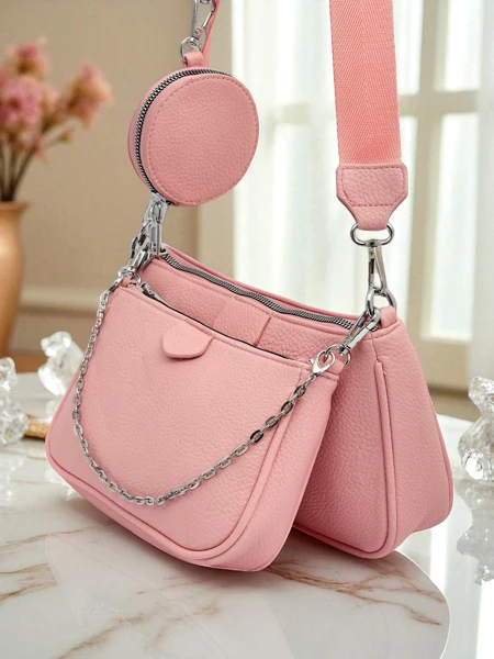 Ženska torbica Amara Rosa – roza poštarska torba iz eko usnja z verižico