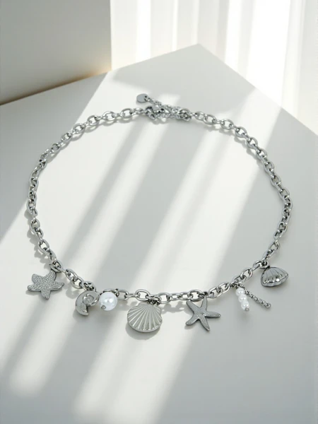 Naszytnik Atena Charm Sea – zlati amuleti z morskimi motivi