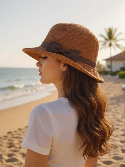Royalfashion Dámsky klobúk zdobený mašľou Summer Grace