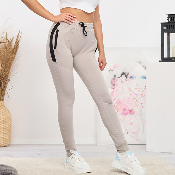 Dámske svetlošedé tepláky s vsadkami- Oblečenie