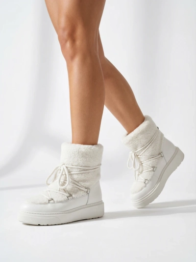 Ženski škornji za sneg s kožuhom Uvella