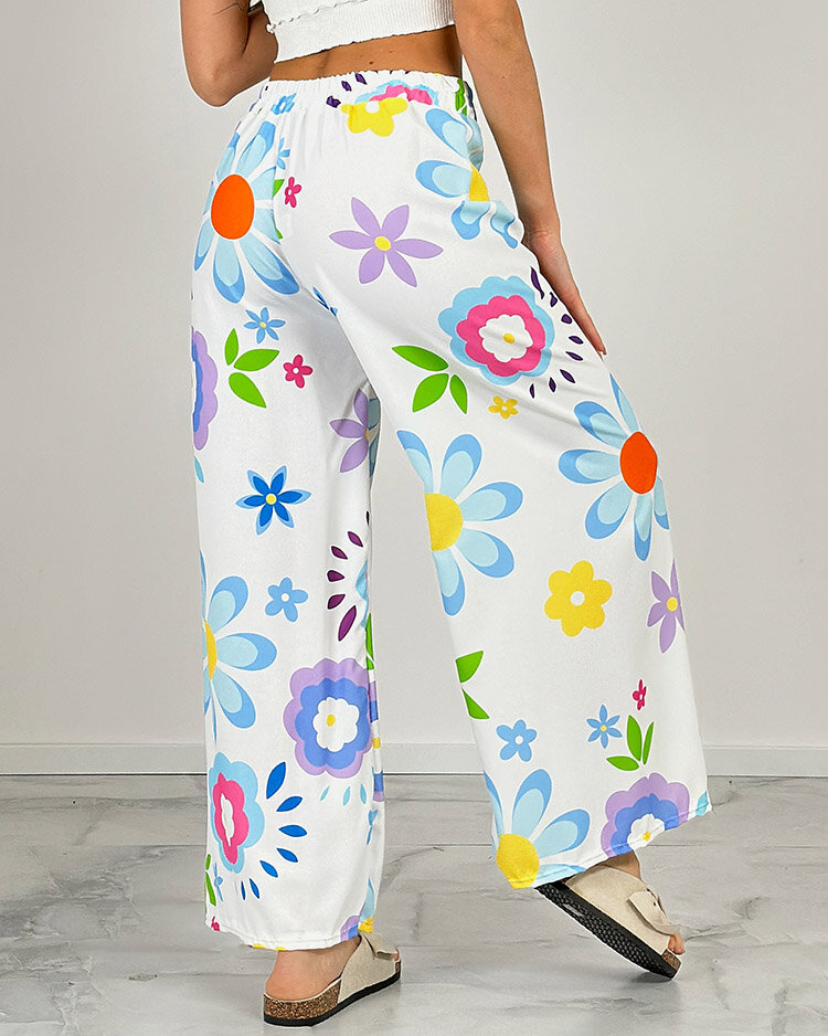 Royalfashion Dámske široké nohavice z kvetinovej látky