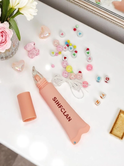 Lesk na pery s náramkom Gloss & Charm Cocoa Cookie