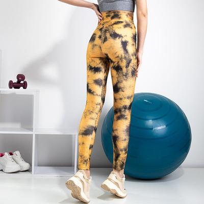 Žlté dámske legíny s ozdobnými škvrnami - Oblečenie