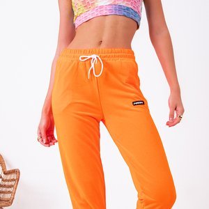 Neonovo oranžové dámske tepláky - Oblečenie